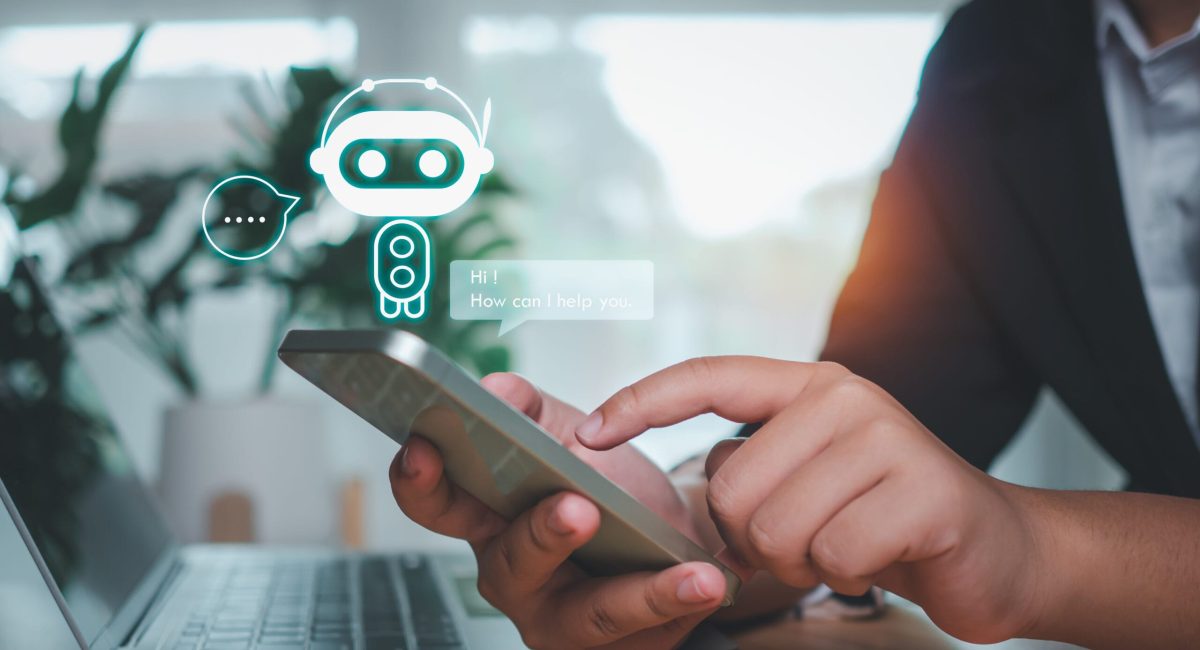 Businessman hand use show a smartphone to type live chat, ask, answer with an artificial intelligence system. chatbot. Ai assistant.